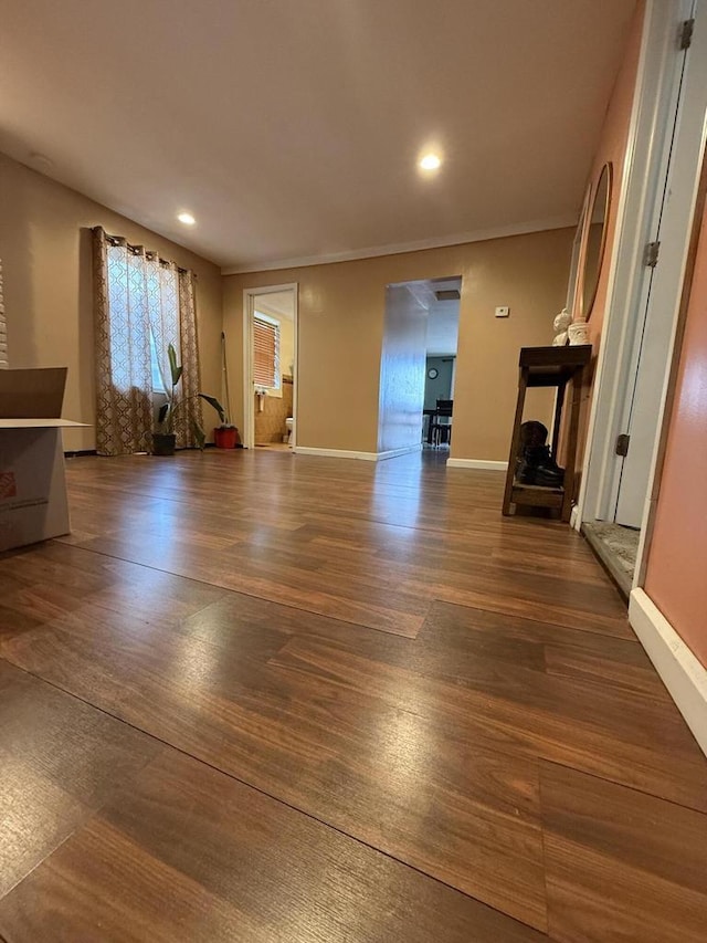 2143 Clark St, Mount Pleasant, WI 53403 - unfurnished living room featuring wood finished floors, baseboards, and recessed lighting