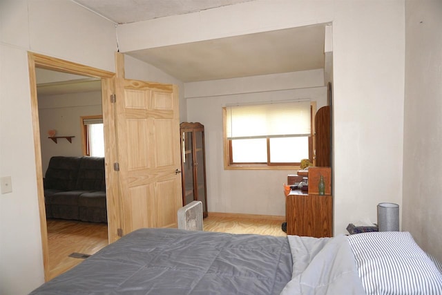 109 N Water St, Eastman, WI 54626 - bedroom featuring lofted ceiling and wood finished floors