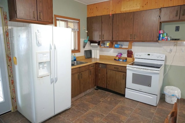 109 N Water St, Eastman, WI 54626 - kitchen with white appliances, open shelves, light countertops, and decorative backsplash
