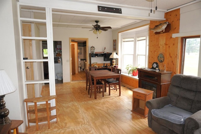109 N Water St, Eastman, WI 54626 - dining area with a ceiling fan, light wood-style floors, healthy amount of natural light, and beamed ceiling