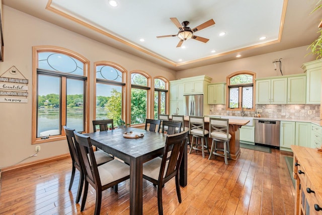 5420 W Peninsula Dr, Waterford, WI 53185 - dining room with a raised ceiling, ceiling fan, light wood-type flooring, and recessed lighting