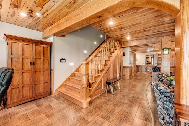 5420 W Peninsula Dr, Waterford, WI 53185 - stairs featuring wood ceiling, arched walkways, wood finished floors, and wooden walls