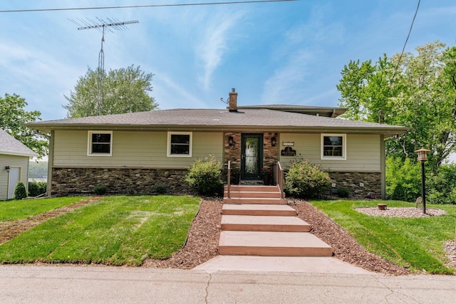 5420 W Peninsula Dr, Waterford, WI 53185 - view of front of home with stone siding and a front yard