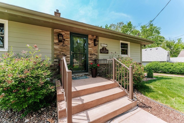 5420 W Peninsula Dr, Waterford, WI 53185 - entrance to property with stone siding and a yard