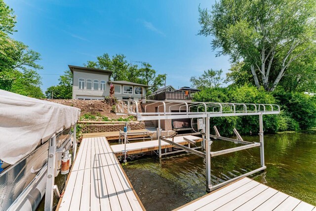 5420 W Peninsula Dr, Waterford, WI 53185 - dock featuring boat lift and a water view