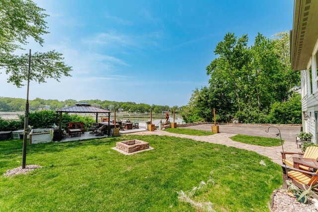 5420 W Peninsula Dr, Waterford, WI 53185 - view of grassy yard featuring a fire pit, a gazebo, and a patio area