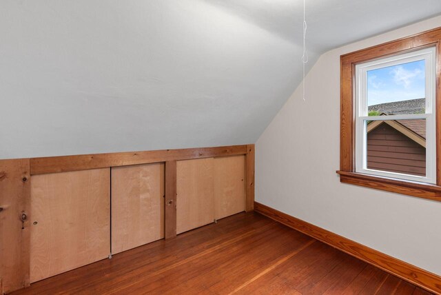 4438 County Road H Prt, Washington, WI 53074 - bonus room with vaulted ceiling, wood finished floors, and baseboards