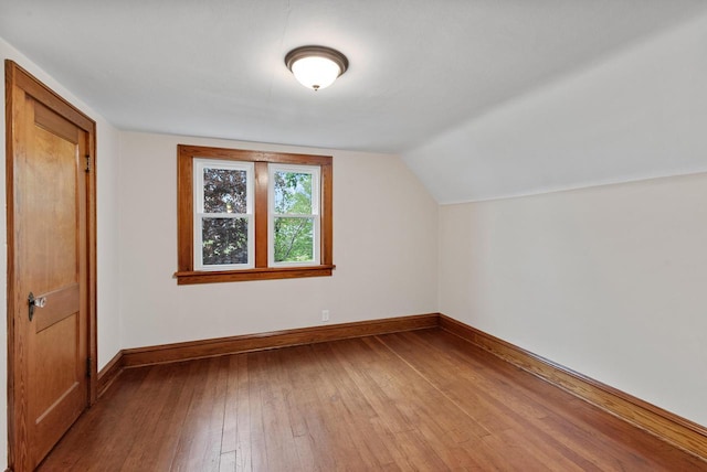 4438 County Road H Prt, Washington, WI 53074 - bonus room featuring baseboards, hardwood / wood-style floors, and lofted ceiling