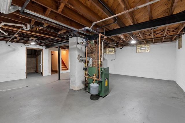 4438 County Road H Prt, Washington, WI 53074 - unfinished below grade area featuring stairs, concrete block wall, and a heating unit