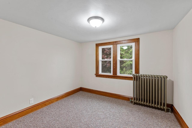 4438 County Road H Prt, Washington, WI 53074 - spare room with radiator, carpet, and baseboards