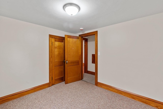 4438 County Road H Prt, Washington, WI 53074 - spare room with baseboards and light carpet