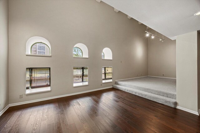 270 E Highland Ave Unit 213, Milwaukee, WI 53202 - empty room featuring hardwood / wood-style floors, baseboards, and a towering ceiling
