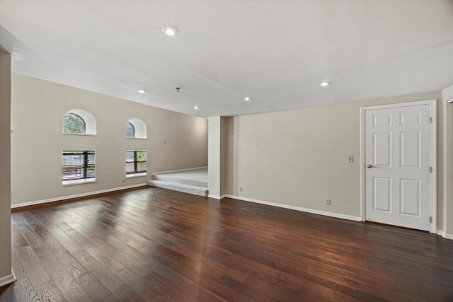 270 E Highland Ave Unit 213, Milwaukee, WI 53202 - unfurnished living room with dark wood finished floors, baseboards, and recessed lighting