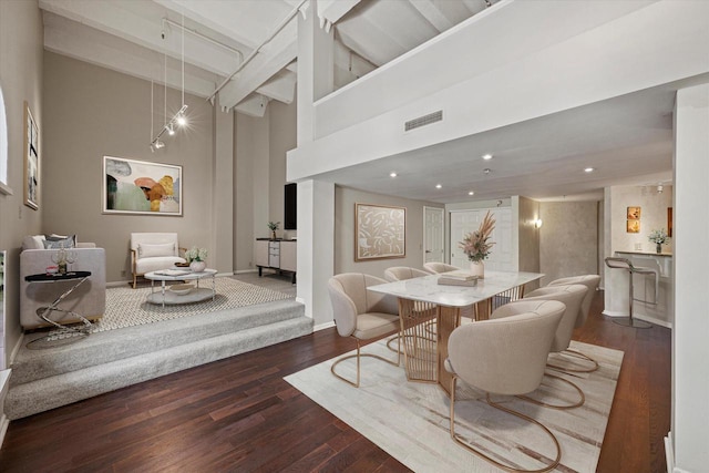 270 E Highland Ave Unit 213, Milwaukee, WI 53202 - dining space featuring a high ceiling, wood finished floors, baseboards, and beamed ceiling