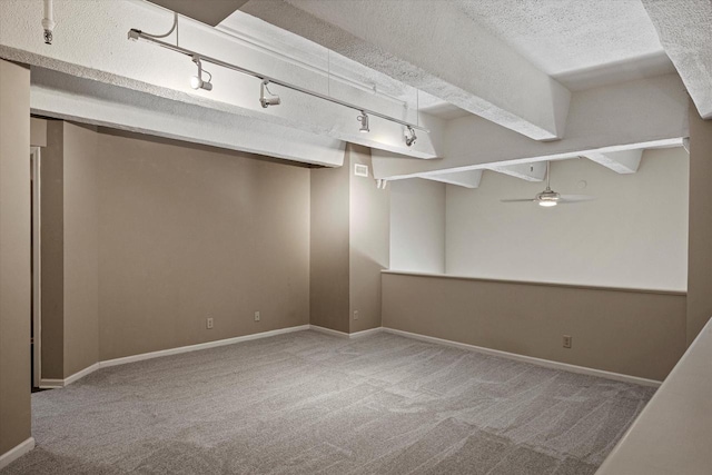 270 E Highland Ave Unit 213, Milwaukee, WI 53202 - below grade area with carpet flooring, ceiling fan, a textured ceiling, baseboards, and track lighting
