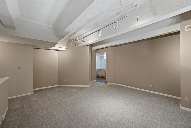 270 E Highland Ave Unit 213, Milwaukee, WI 53202 - finished below grade area with carpet floors, baseboards, and track lighting