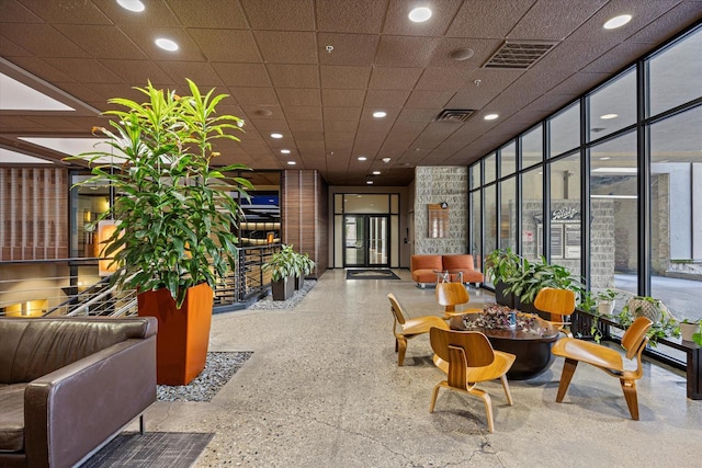 270 E Highland Ave Unit 213, Milwaukee, WI 53202 - building lobby with a wall of windows and recessed lighting