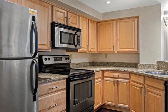 270 E Highland Ave Unit 213, Milwaukee, WI 53202 - kitchen featuring stainless steel appliances, light brown cabinetry, a sink, recessed lighting, and light stone counters