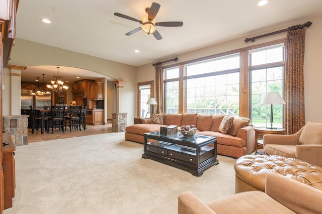 1252 Mary Hill Cir, Hartland, WI 53029 - living room with a chandelier, recessed lighting, a ceiling fan, arched walkways, and light colored carpet