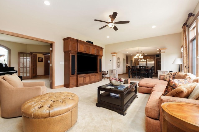 1252 Mary Hill Cir, Hartland, WI 53029 - living area featuring a chandelier, a ceiling fan, recessed lighting, light carpet, and arched walkways