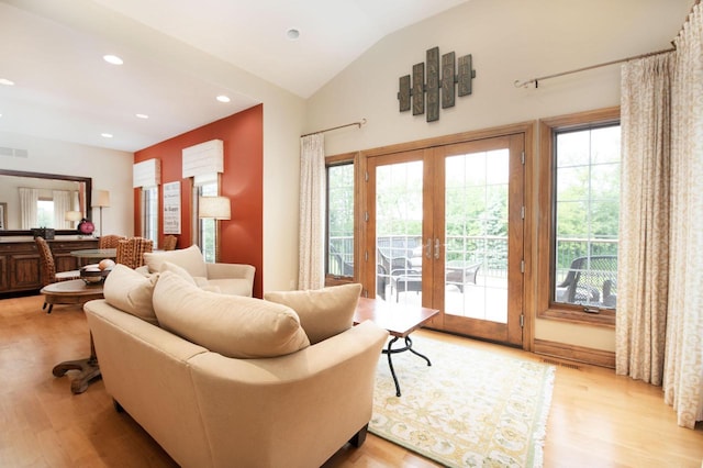 1252 Mary Hill Cir, Hartland, WI 53029 - living room featuring french doors, light wood-style flooring, plenty of natural light, lofted ceiling, and recessed lighting