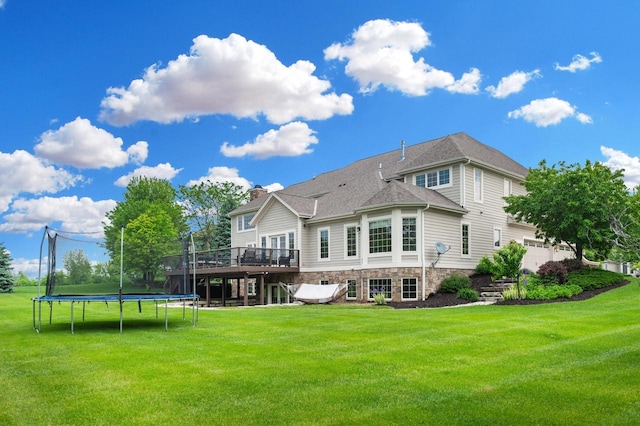 1252 Mary Hill Cir, Hartland, WI 53029 - rear view of property featuring a trampoline, a deck, a yard, and a chimney