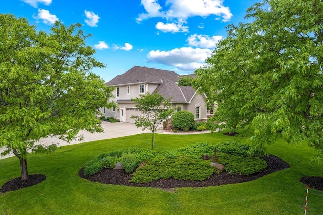1252 Mary Hill Cir, Hartland, WI 53029 - view of front of property featuring a garage, concrete driveway, a front lawn, and a shingled roof