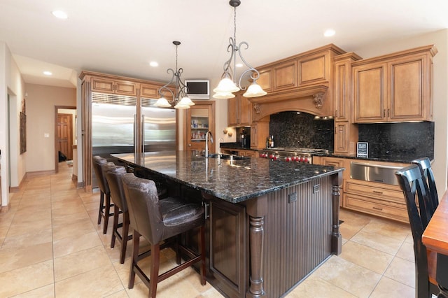 1252 Mary Hill Cir, Hartland, WI 53029 - kitchen featuring a sink, tasteful backsplash, a warming drawer, recessed lighting, and light tile patterned flooring