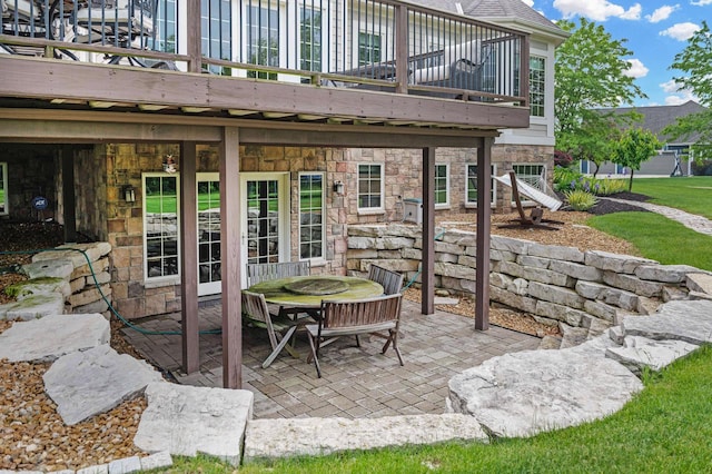 1252 Mary Hill Cir, Hartland, WI 53029 - view of patio featuring a wooden deck, outdoor dining space, and stairs