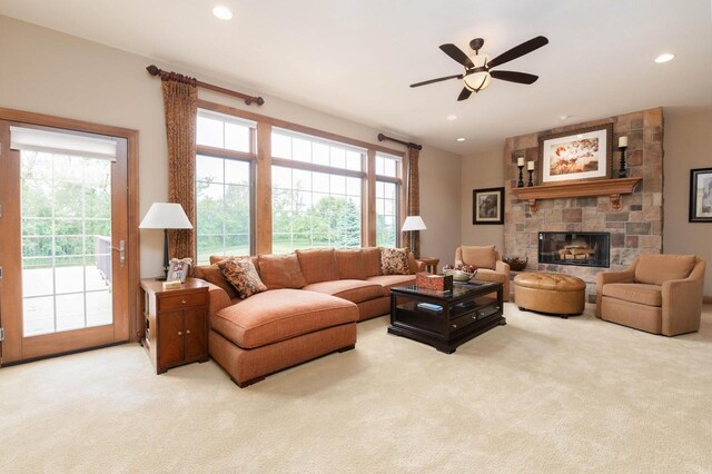1252 Mary Hill Cir, Hartland, WI 53029 - living area with light carpet, plenty of natural light, ceiling fan, a fireplace, and recessed lighting