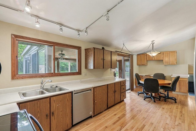 8845 388th Ave, Burlington, WI 53105 - kitchen with stainless steel dishwasher, light wood-type flooring, rail lighting, light countertops, and brown cabinets