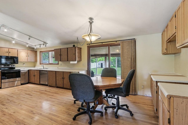 8845 388th Ave, Burlington, WI 53105 - kitchen with stainless steel appliances, light countertops, light wood finished floors, and hanging light fixtures