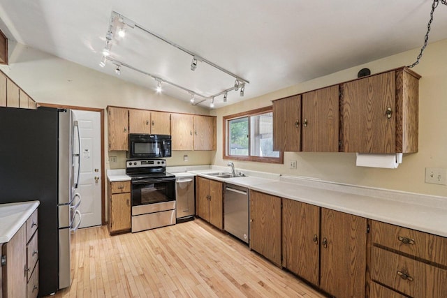 8845 388th Ave, Burlington, WI 53105 - kitchen featuring appliances with stainless steel finishes, rail lighting, light wood-type flooring, and light countertops