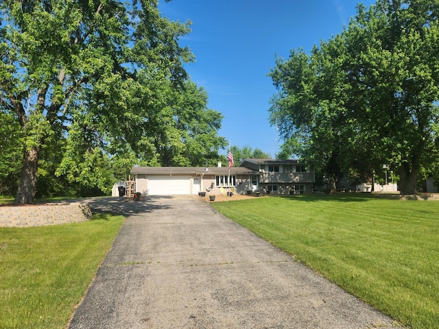8845 388th Ave, Burlington, WI 53105 - split level home featuring asphalt driveway, a garage, and a front yard