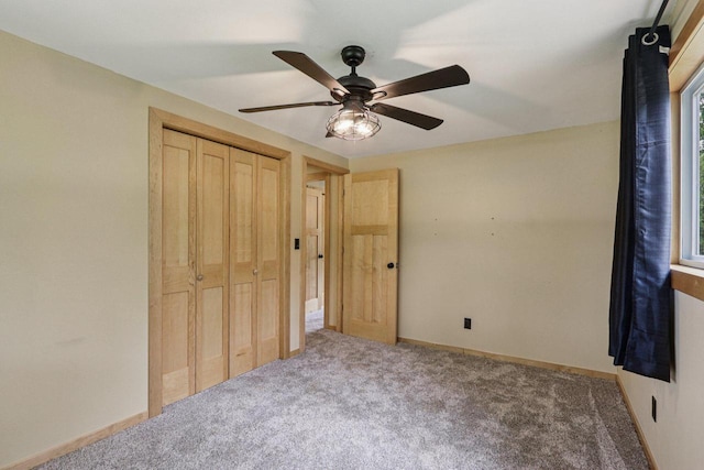 8845 388th Ave, Burlington, WI 53105 - unfurnished bedroom with carpet, a closet, ceiling fan, and multiple windows