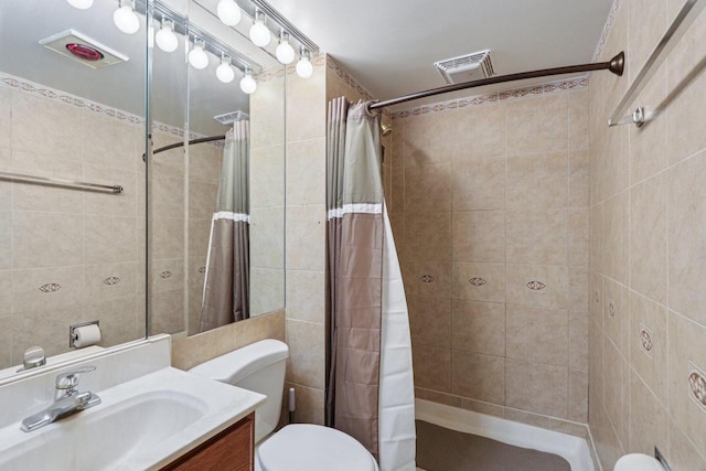 8845 388th Ave, Burlington, WI 53105 - full bath with vanity, a tile shower, and tile walls