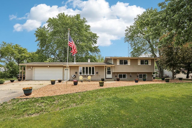 8845 388th Ave, Burlington, WI 53105 - split level home featuring an attached garage, concrete driveway, and a front yard