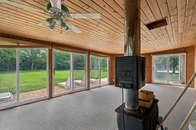 8845 388th Ave, Burlington, WI 53105 - sunroom featuring a ceiling fan and a wood stove