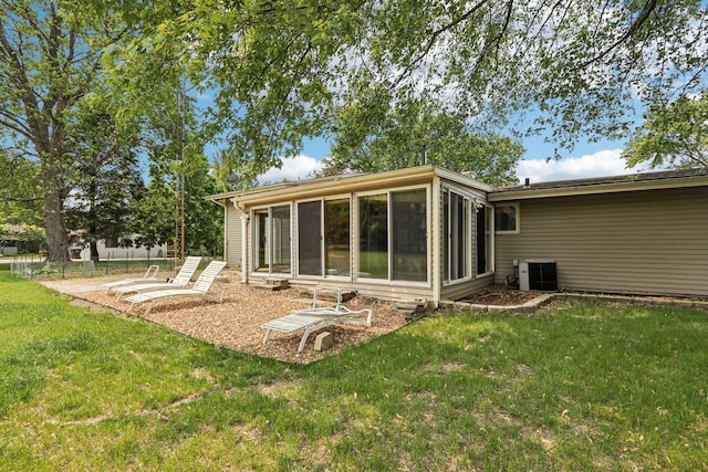 8845 388th Ave, Burlington, WI 53105 - back of house with a sunroom and a lawn