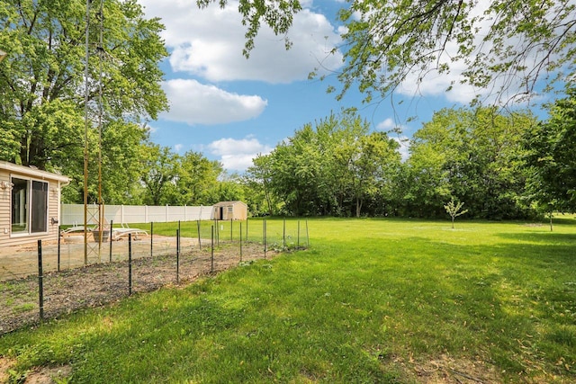 8845 388th Ave, Burlington, WI 53105 - view of yard featuring a vegetable garden, view of scattered trees, and a storage unit