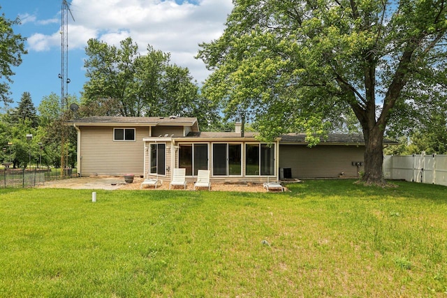 8845 388th Ave, Burlington, WI 53105 - rear view of house featuring a fenced backyard and a sunroom