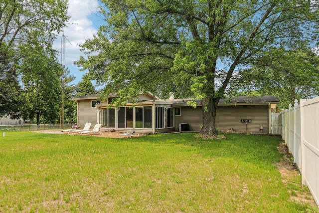 8845 388th Ave, Burlington, WI 53105 - back of property featuring a sunroom and a fenced backyard