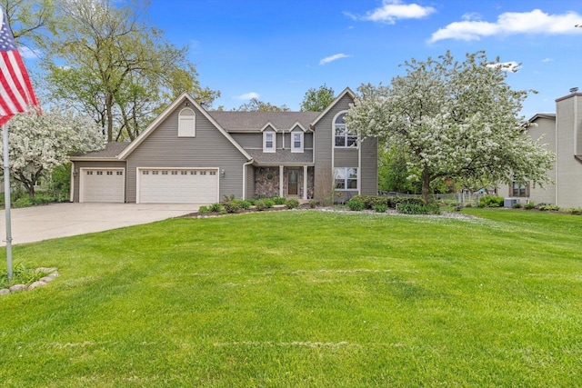 6705 Brian Dr, Waterford, WI 53185 - view of front of house with a garage, driveway, and a front yard