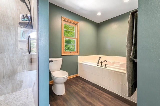 6705 Brian Dr, Waterford, WI 53185 - full bathroom with wood finished floors, a bath, baseboards, toilet, and tiled shower
