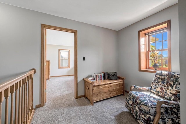 6705 Brian Dr, Waterford, WI 53185 - living area featuring light colored carpet, plenty of natural light, and baseboards