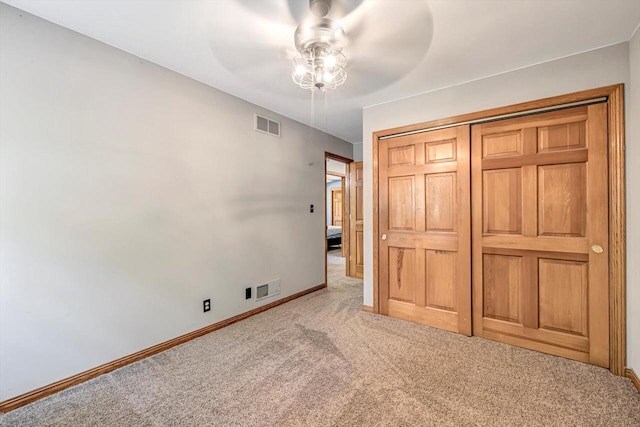 6705 Brian Dr, Waterford, WI 53185 - unfurnished bedroom with carpet flooring, baseboards, a closet, and a ceiling fan