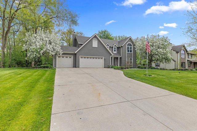 6705 Brian Dr, Waterford, WI 53185 - view of front of house with a garage, concrete driveway, and a front yard