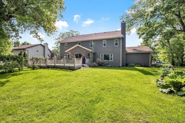 6705 Brian Dr, Waterford, WI 53185 - rear view of house featuring a chimney, a lawn, and a deck