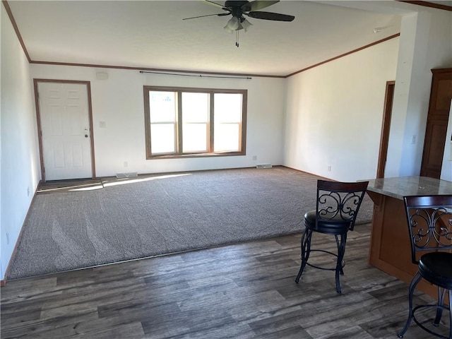 163 230th St, Osceola, WI 54020 - unfurnished living room with a ceiling fan, ornamental molding, dark wood-style floors, and baseboards