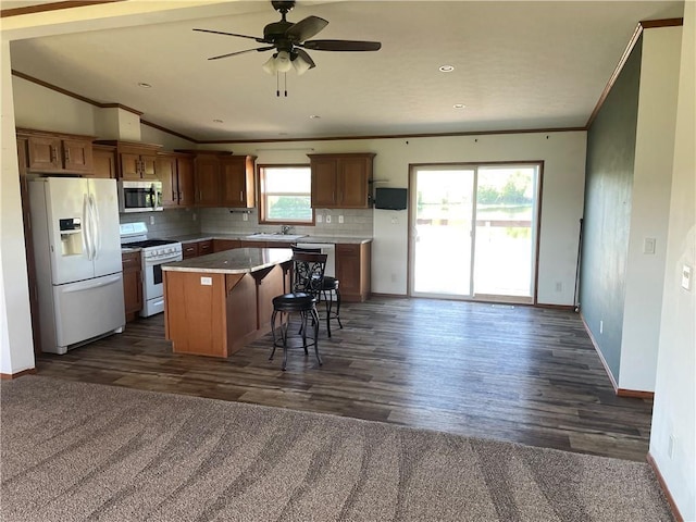 163 230th St, Osceola, WI 54020 - kitchen with appliances with stainless steel finishes, ornamental molding, a kitchen island, open floor plan, and baseboards